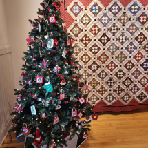Tree in front of quilt